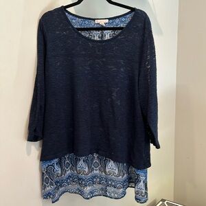 Blue sweater with beautiful under print that adds length and style.